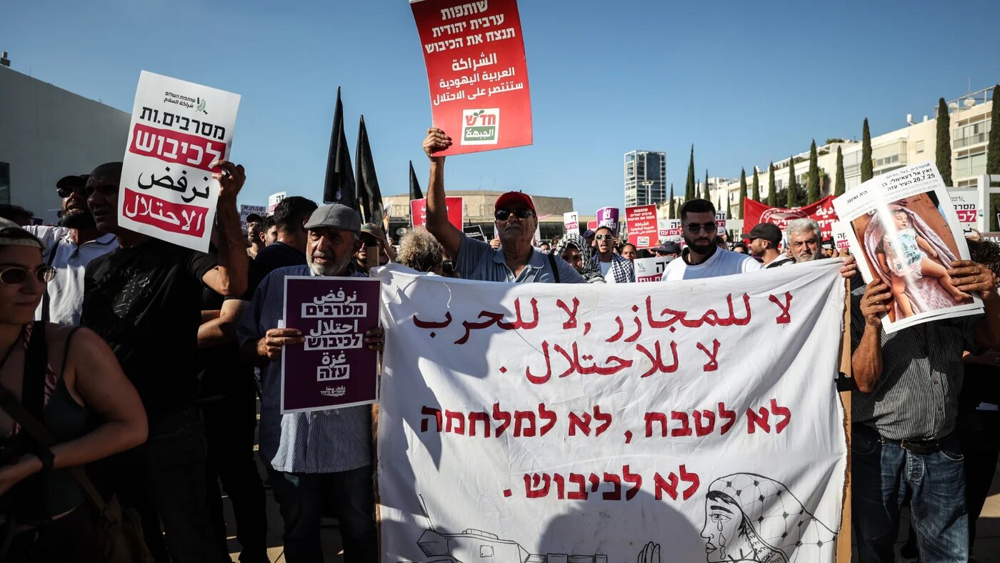 Palestinian citizens of Israel pictured during a protest in Tel Aviv against the war on Gaza on 23 August 2025 (Saeed Qaq/ZUMA Press Wire via Reuters)
