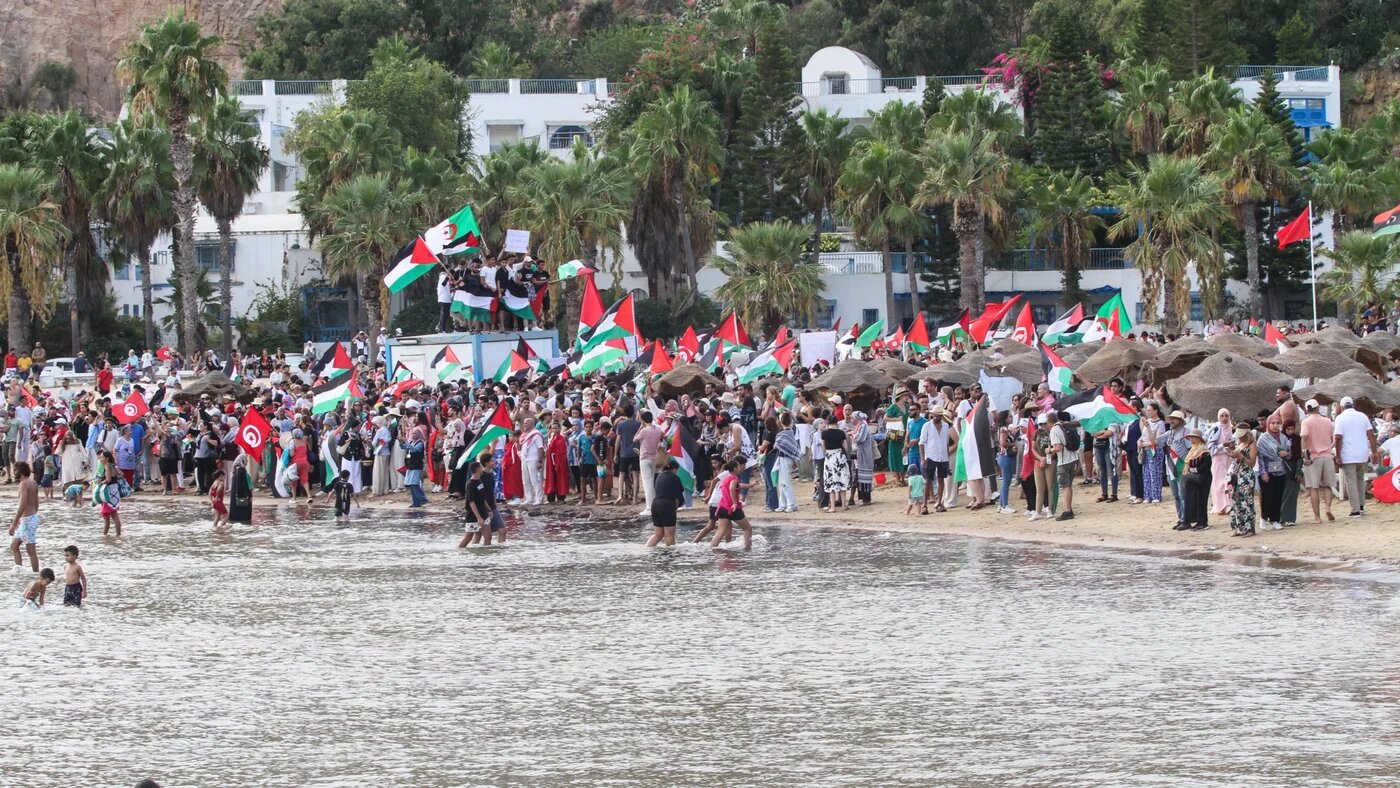 Participants arrive at Sidi Bou Said port in support of the Global Sumud Flotilla, a civilian aid fleet including activists, artists, politicians, doctors and journalists from more than 44 countries preparing to sail to Gaza, in Tunis, Tunisia, on 7 September 2025 (Hasan Mrad/ZUMA Press Wire)