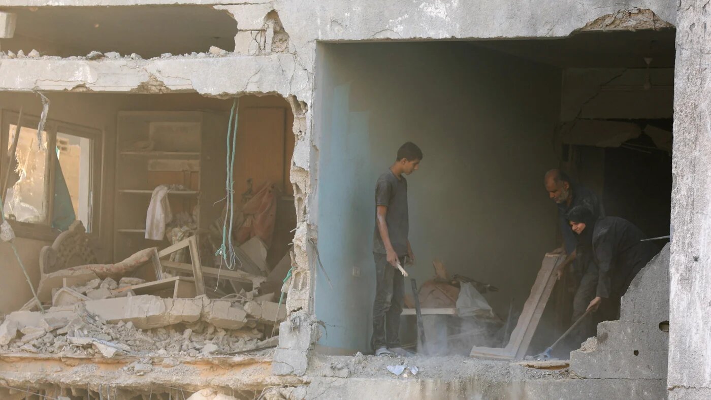 Palestinians inspect the damage at the site of Israeli strikes that destroyed Al-Jundi al-Majhoul residential tower on Sunday, in Gaza City, 15 September 2025 (Reuters/Dawoud Abu Alkas)
