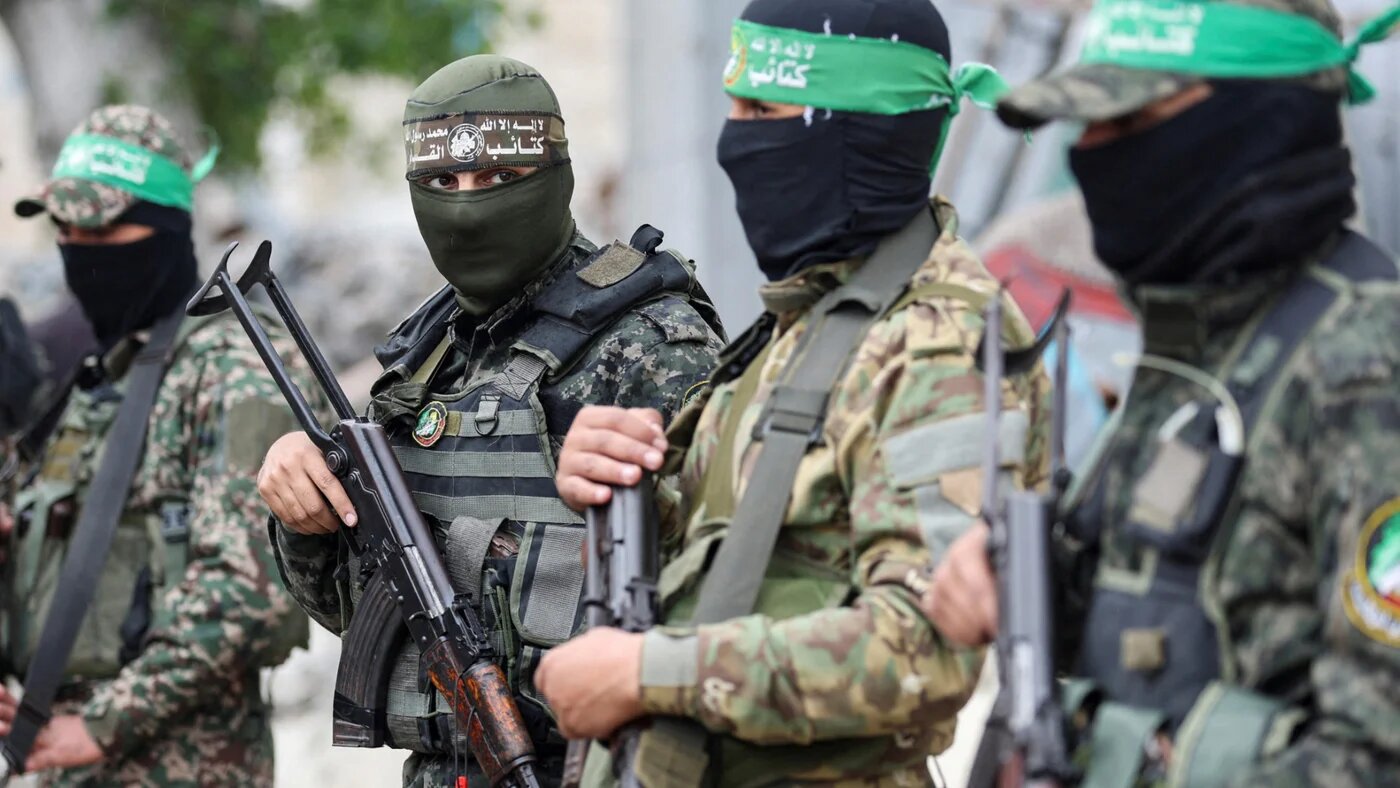 Hamas fighters stand guard at the funeral of deputy military commander Marwan Issa in the central Gaza Strip, 7 February 2025 (Reuters/Ramadan Abed)