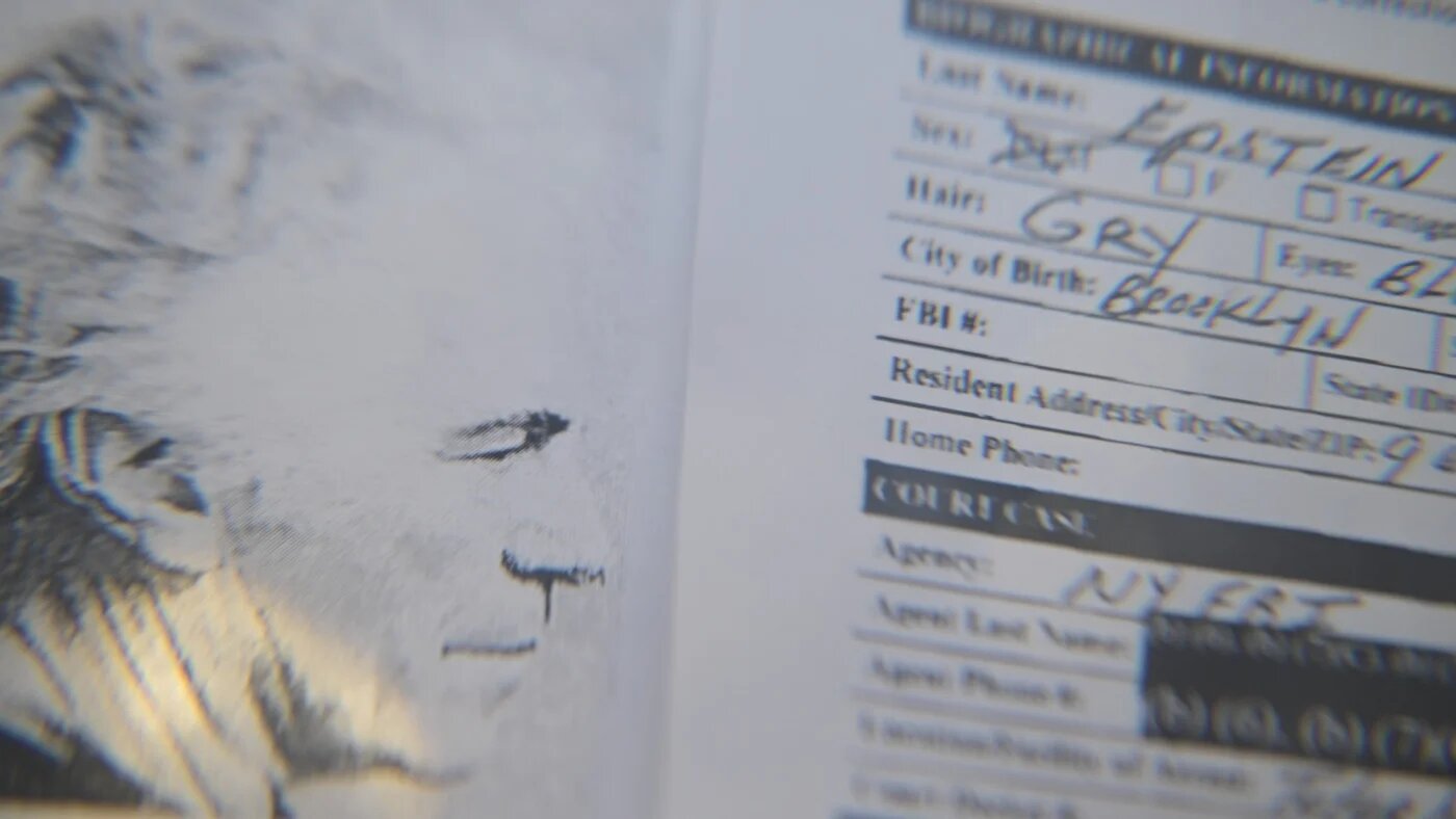 A photograph of Jeffrey Epstein is displayed alongside court documents (Vladislav Nekrasov/SOPA Images via Reuters)