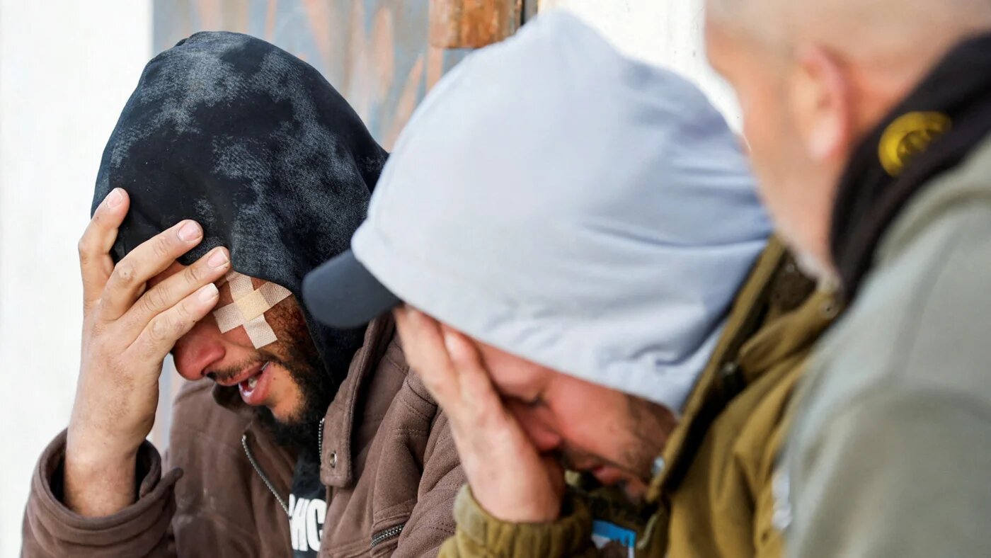 Mourners react during the funeral of Palestinian Ameer Shanaran, who was killed by an Israeli settler in Yatta near Hebron in the occupied West Bank on 8 March 2026 (Reuters/Mussa Qawasma)