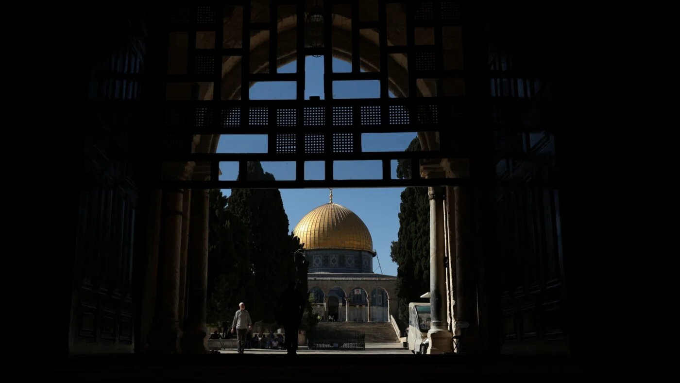 Palestinians walk near the Dome of the Rock inside Al-Aqsa Mosque complex in occupied East Jerusalem, 23 June 2026 (Ammar Awad/Reuters)