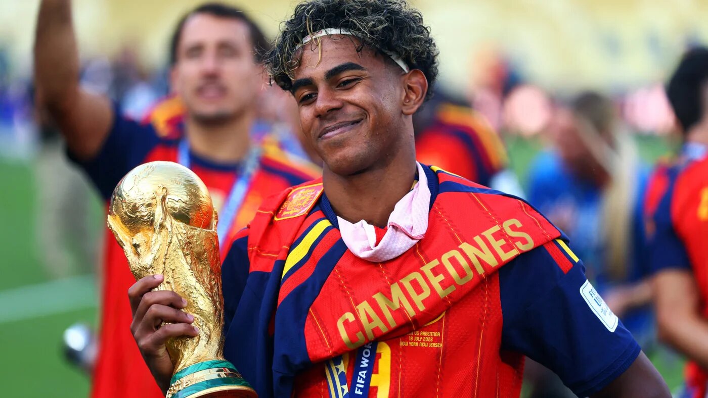 Spain's Lamine Yamal lifts the World Cup trophy as he celebrates winning the World Cup, 19 July 2026 (Reuters)