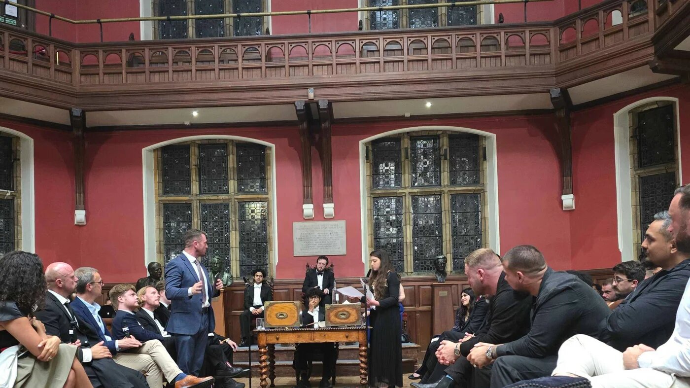 Tommy Robinson and Arwa Elrayess at the Oxford Union on Wednesday. (Imran Mulla/MEE)