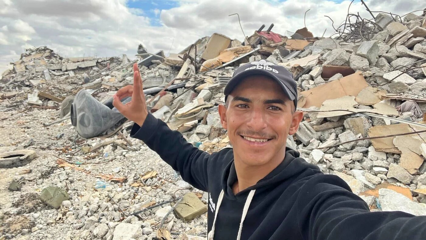 Amr Aborouk is pictured amid the rubble of what used to be his home in the town of Khuzaa, in the Gaza Strip, after it was destroyed by Israeli forces (Supplied)