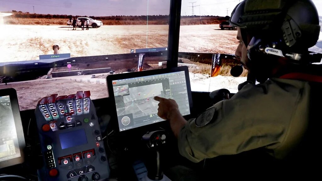 A Rafael Advanced Defence Systems employee operates systems of the Carmel project, a new combat vehicle, in Elkayim in northern Israel on 4 August 2019 (AFP)