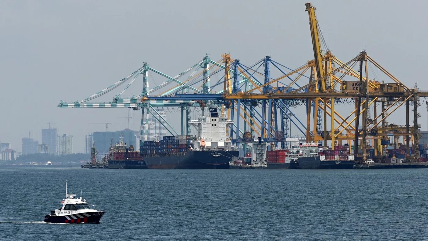 A Singapore Police Coast Guard boat patrols the Johor Strait near Pasir Gudang, Malaysia, on 5 October 2019 (Roslan Rahman/AFP)