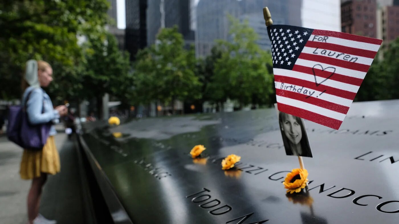 A US flag is placed near a victim's name at the September 11 Memorial at Ground Zero 