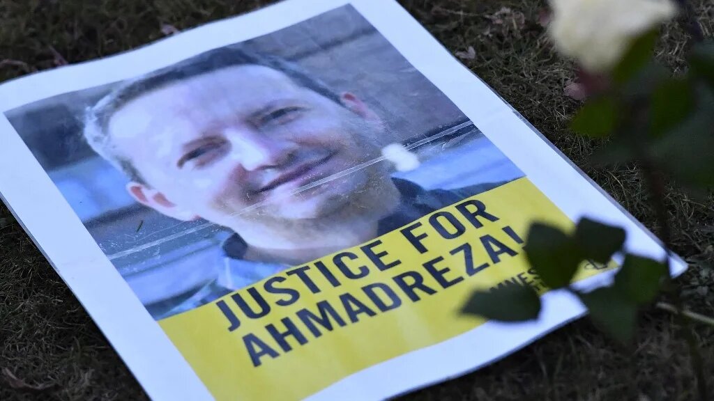 A leaflet during a protest in February 2017 outside the Iranian embassy in Brussels for Ahmadreza Djalali, a Swedish-Iranian academic sentenced to death in Tehran (AFP)