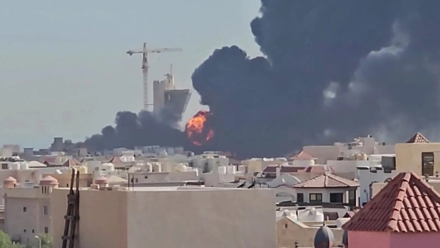 A plume of black smoke and flames rises over Mangaf, south of Kuwait City, after reported attacks on civilian infrastructure, 18 July 2026 (UGC/AFP)