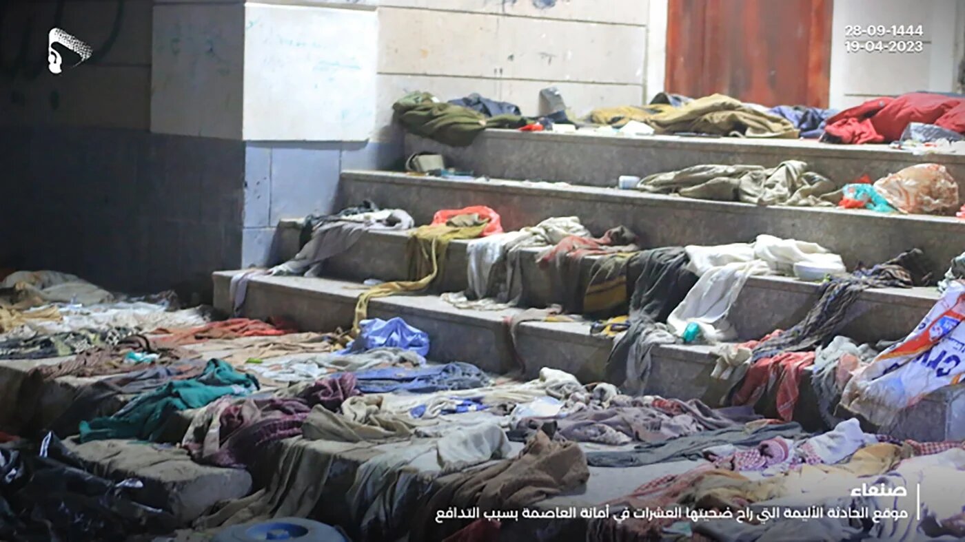 This image released by the Houthi media office shows the aftermath of a deadly crush in Sanna, 19 April (AP)