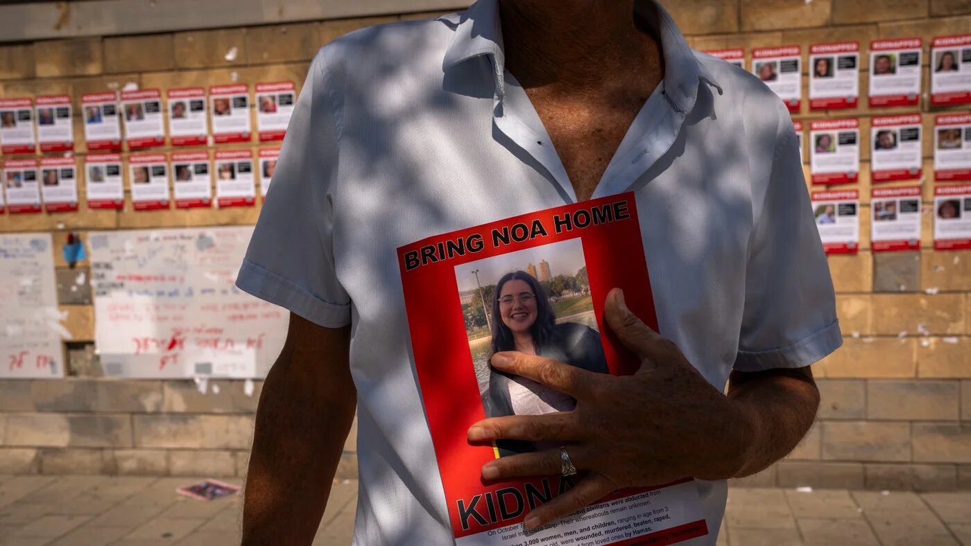 Families and supporters of Israelis held captive in Gaza call for their release during a demonstration in Tel Aviv, 18 October (AP)