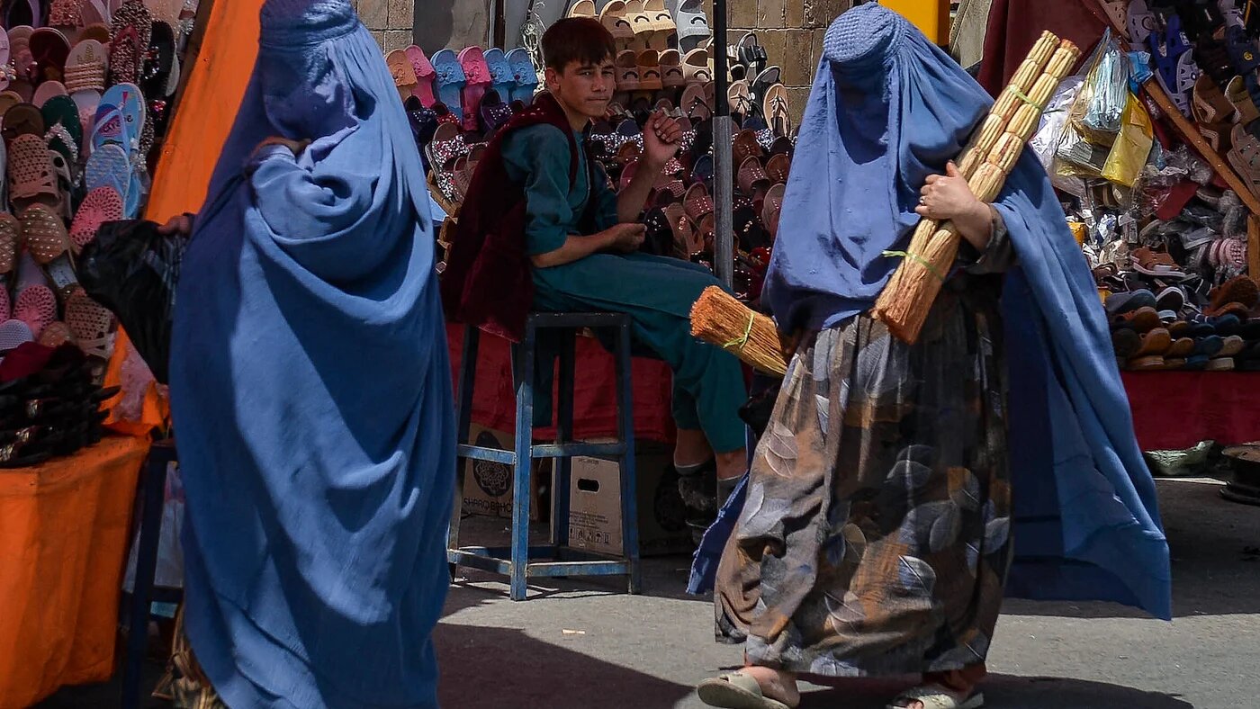 Women in burqa at market in Afghanistan after Taliban seized power