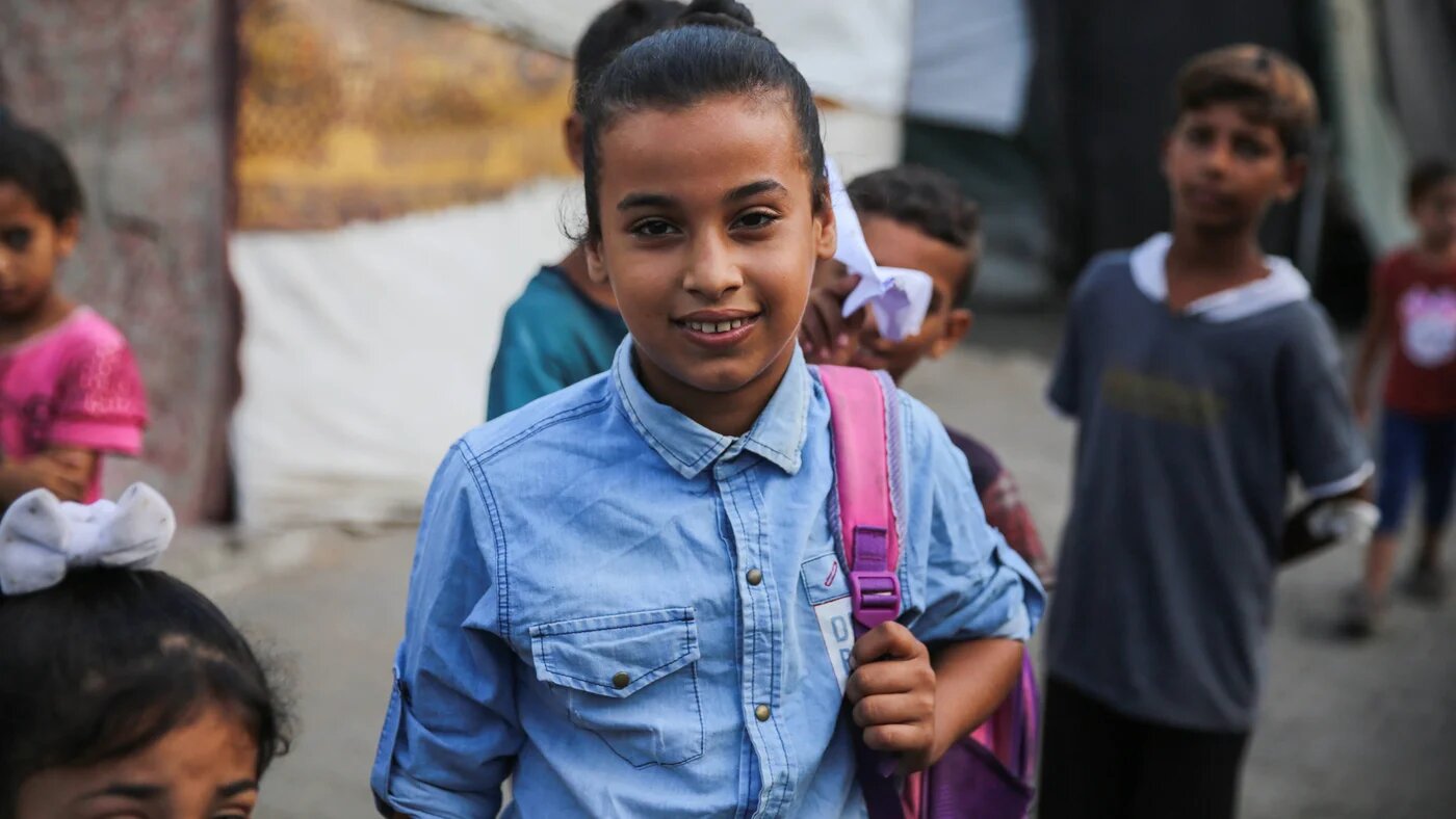 Afnan al-Shenbari, 12, replaced the school books in her backpack with clothes as she and her family fled their home in northern Gaza (Mohammed Hajjar/MEE)