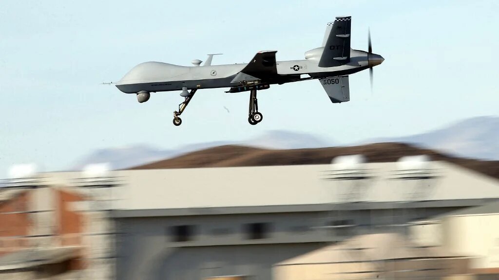 An MQ-9 Reaper remotely piloted aircraft (RPA) flies by during a training mission at Creech Air Force Base on November 17, 2015 in Indian Springs, Nevada