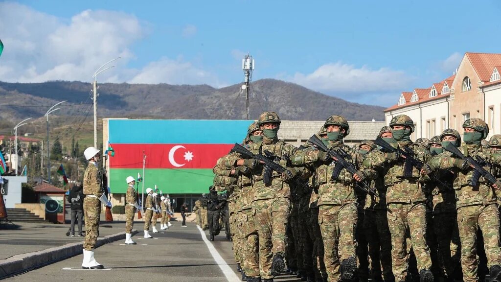 Azerbaijani troops parade in the town of Khankendi in Nagorno-Karabakh in November 2023 (AFP)
