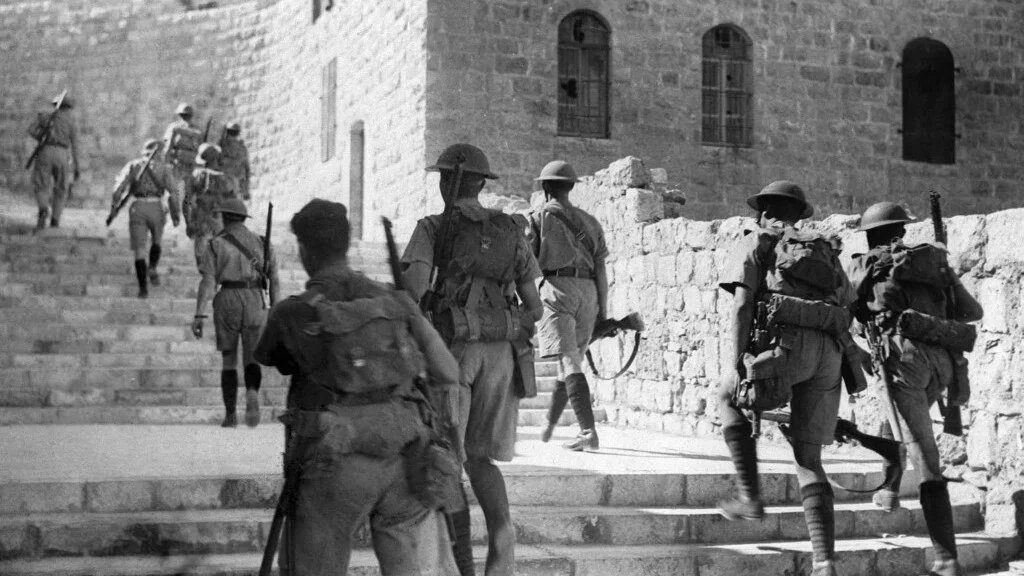 British soldiers enter the old city of Jerusalem to impose a curfew following Arab rioting against Jews during the British Mandate in Palestine, 19 October 1938 (Eric Matson/GPO/AFP)