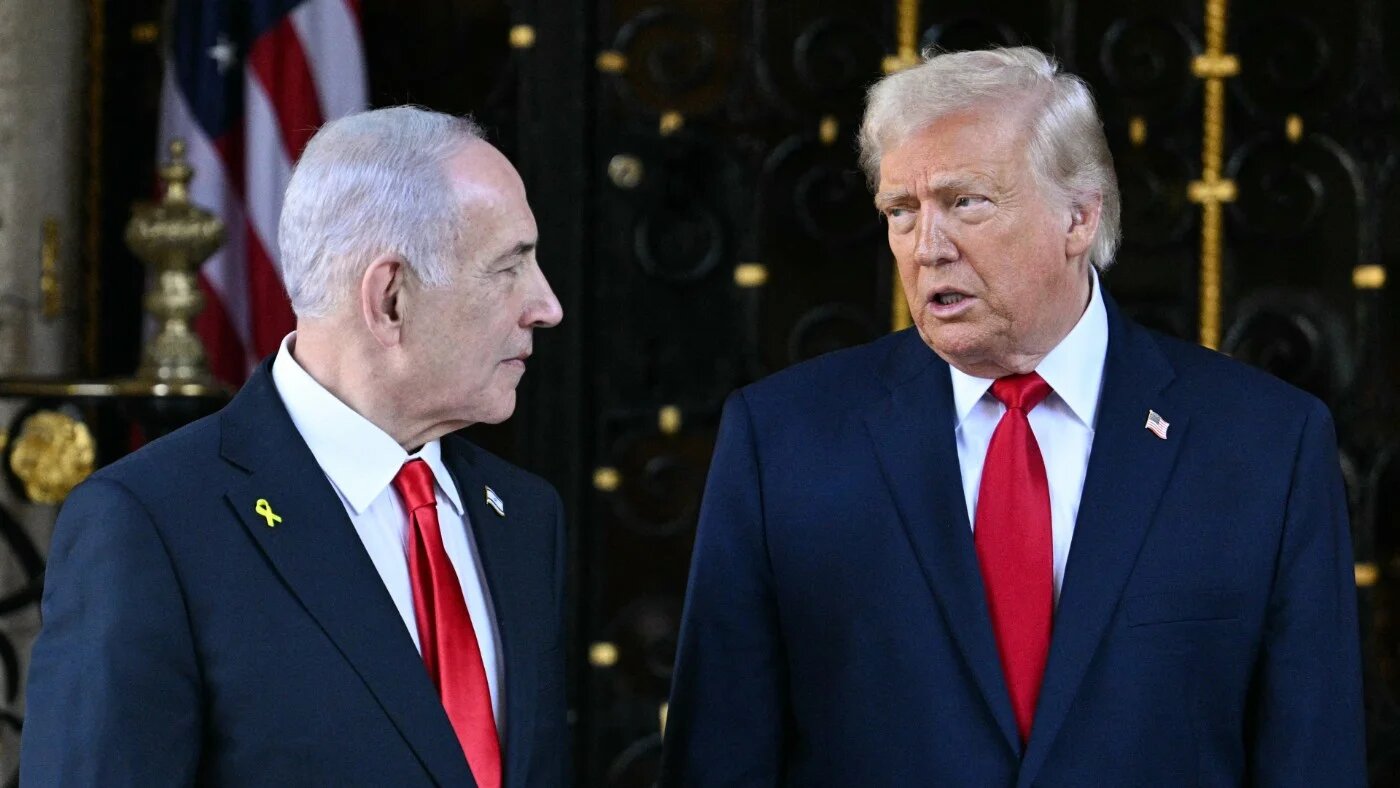 US President Donald Trump greets Israeli Prime Minister Benjamin Netanyahu upon arrival at Trump’s Mar-a-Lago residence in Palm Beach, Florida, on 29 December 2025 (Jim Watson/AFP)