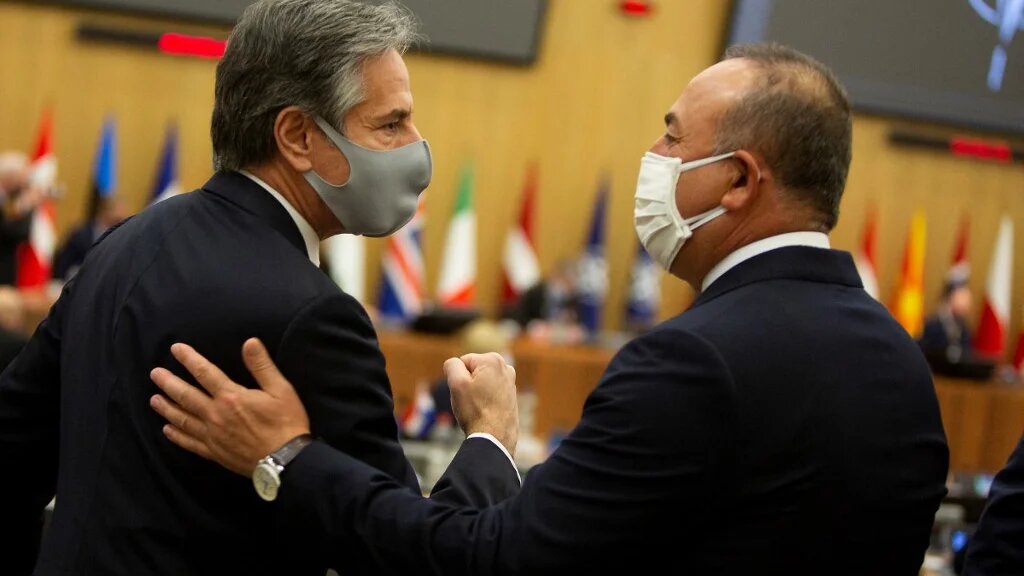 US Secretary of State Antony Blinken greets Turkish Foreign Minister Mevlut Cavusoglu at the Nato headquarters