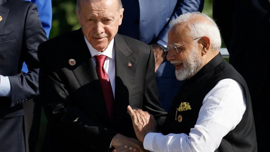 Turkish President Recep Tayyip Erdogan (left) and Indian Prime Minister Narendra Modi (right) pictured after the first session of the G20 Leaders' Summit in Rio de Janeiro, Brazil, on 18 November 2024 (Ludovic Marin/AFP)