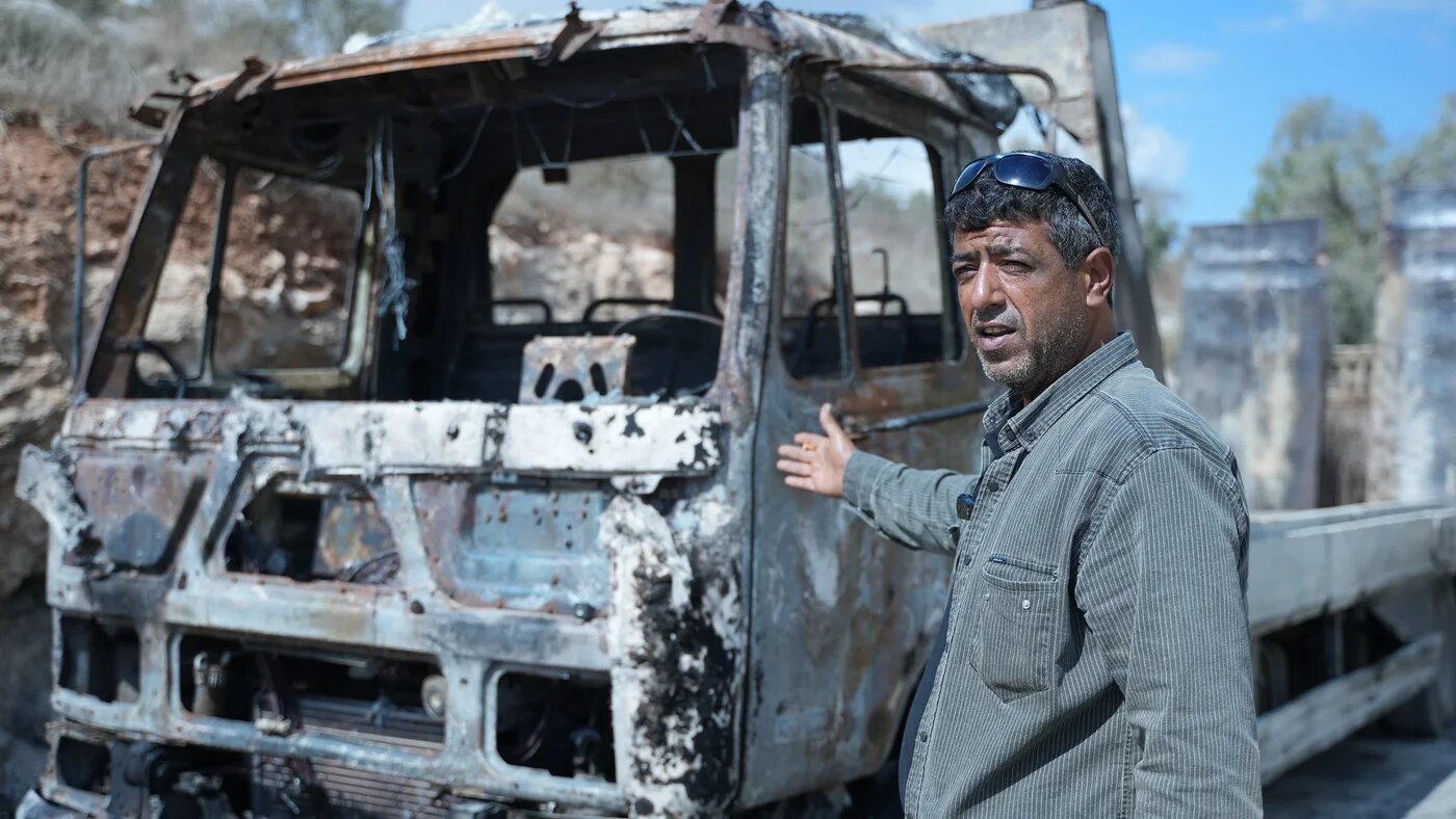 Abdullah Odeh was unable to stop settlers burning trucks around his amusement park because Israeli soldiers wouldn't let him intervene (MEE/Akram al-Waara)