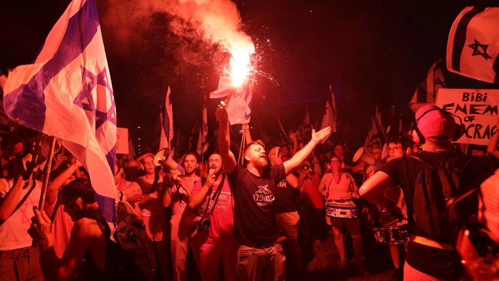 Demonstrators attend a protest against the Israeli government's judicial overhaul bill, in Tel Aviv on 15 July 2023 (AFP)