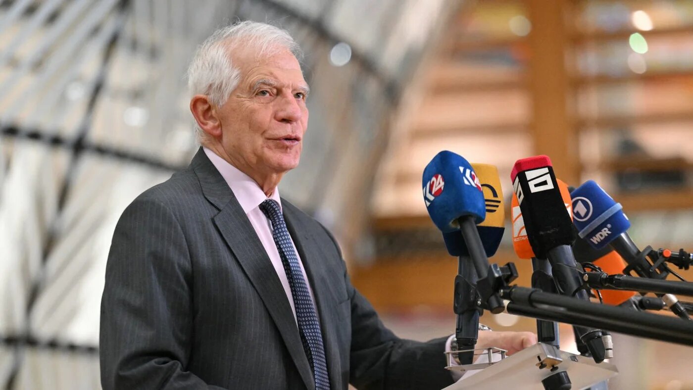 Former EU foreign policy chief Josep Borrell speaks to reporters before a meeting of EU defence ministers in Brussels, 19 November 2024 (Nicolas Tucat/AFP)