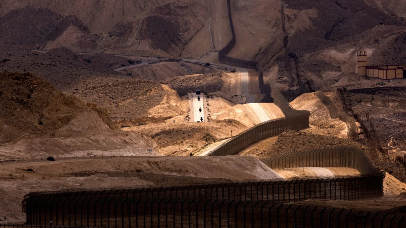An Egyptian military outpost overlooks the Israel-Egypt border as seen from southern Israel, 27 September 2021 (Reuters)