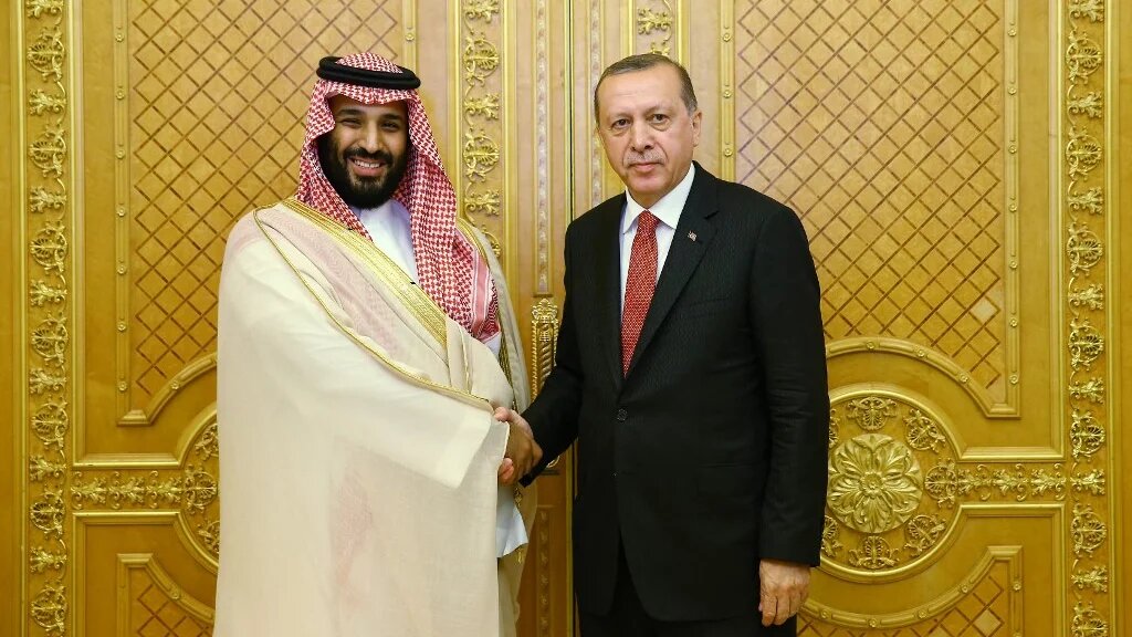 Turkish President Recep Tayyip Erdogan (R) shaking hands with Saudi Crown Prince Mohammed bin Salman (L) during a meeting as part of an official visit in Jeddah, Saudi Arabia.