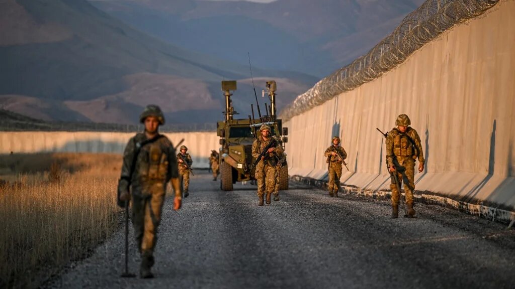 Turkish soldiers patrol near the border wall with Iran in the Van Province, eastern Turkey, on 1 November 2024 (Ozan Kose/AFP)