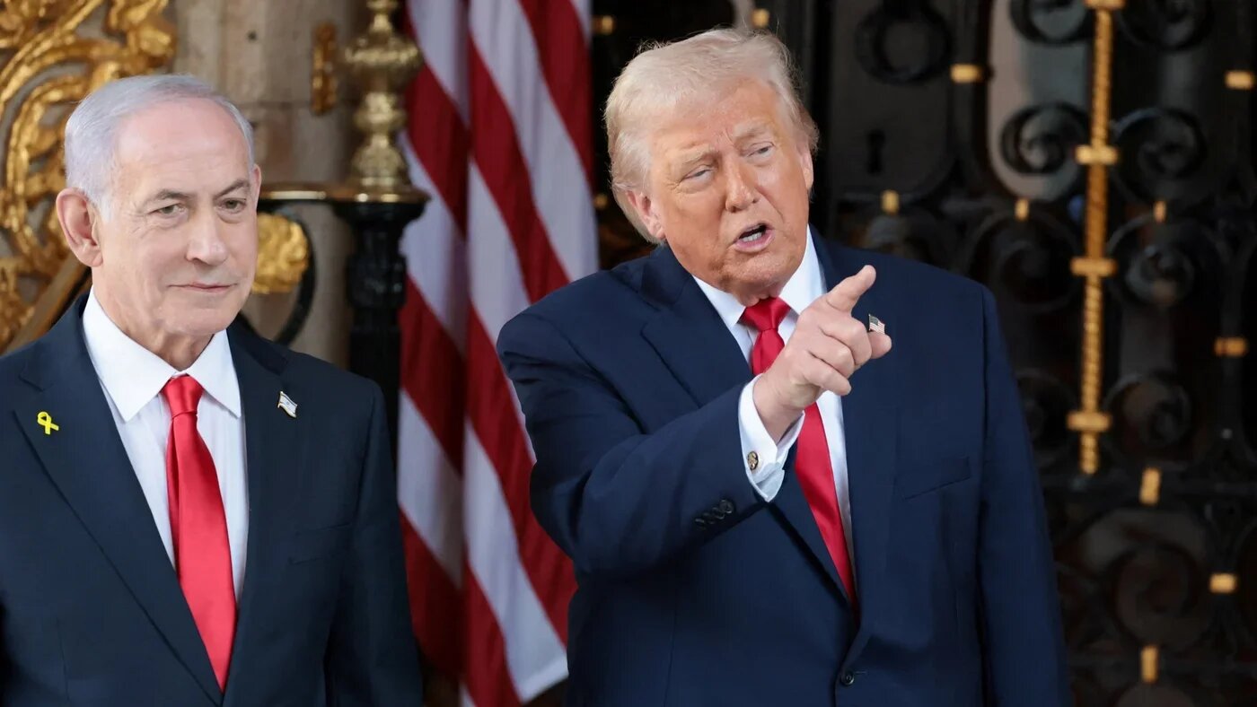 US President Donald Trump speaks to reporters next to Israeli Prime Minister Benjamin Netanyahu outside Mar-a-Lago resort in Florida on 29 December 2025 (Jonathan Ernst/Reuters)