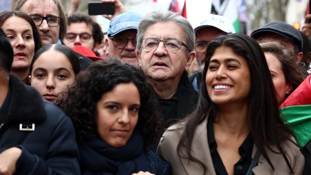 LFI's Jean-Luc Melenchon (center), Rima Hassan (right), and Manon Aubry (left) during a demonstration calling for an immediate ceasefire in Gaza in Paris, 9 March (Emmanuel Dunand/AFP)