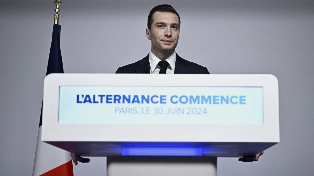 French far-right National Rally (RN) president Jordan Bardella gives a speech during the results evening of the first round of the parliamentary elections in Paris on 30 June (Julien de Rosa/AFP)