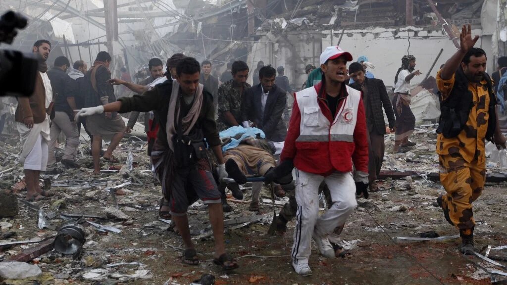 Yemeni medics and rescue workers at the funeral hall in Sanaa after Saudi-led coalition airplanes bombings on 8 October 2016 (AFP) 