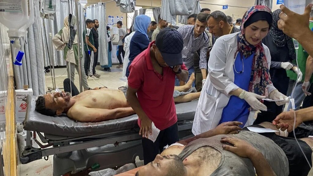 Palestinians who were injured by Israeli fire as they gathered near a food aid centre receive care at Nasser hospital in Khan Younis, Gaza on 17 June 2025 (AFP)