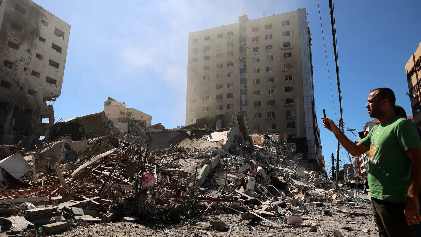 A building hit and destroyed during an Israeli air strike in Gaza City, 15 May.