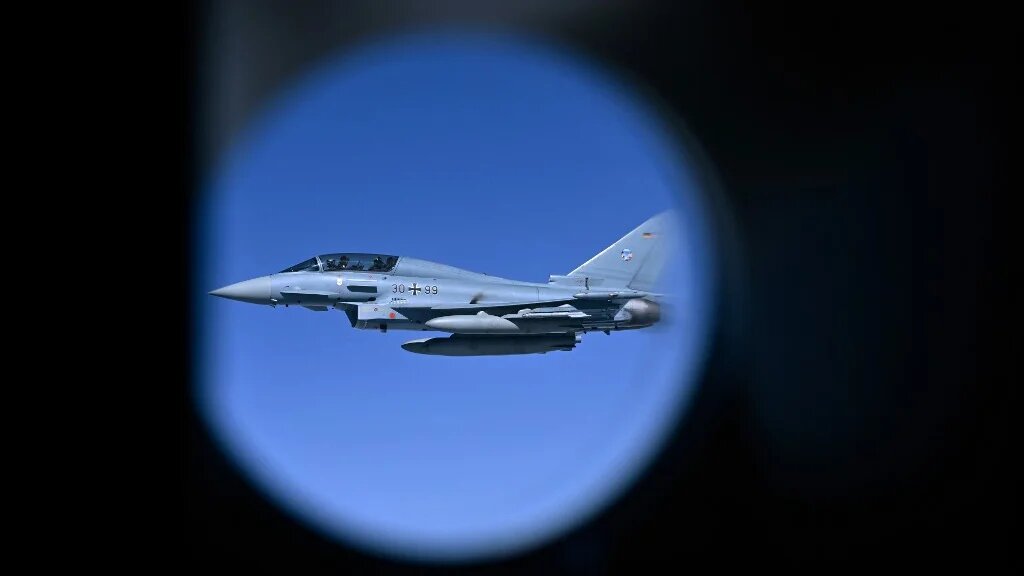 A German Air Force Eurofighter Typhoon fighter participates in a Nato Air Policing mission exercise on 4 July 2023 (John Thys/AFP)