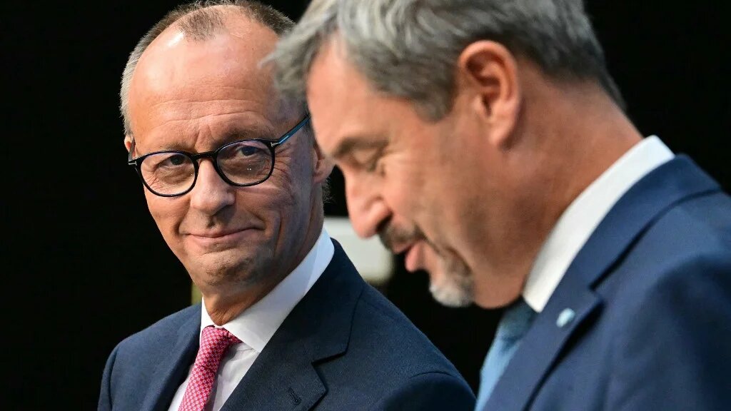 Friedrich Merz, leader of the CDU, and Bavaria's State Premier Markus Soder address a news conference on 17 September in Berlin (Tobias Schwarz/AFP)