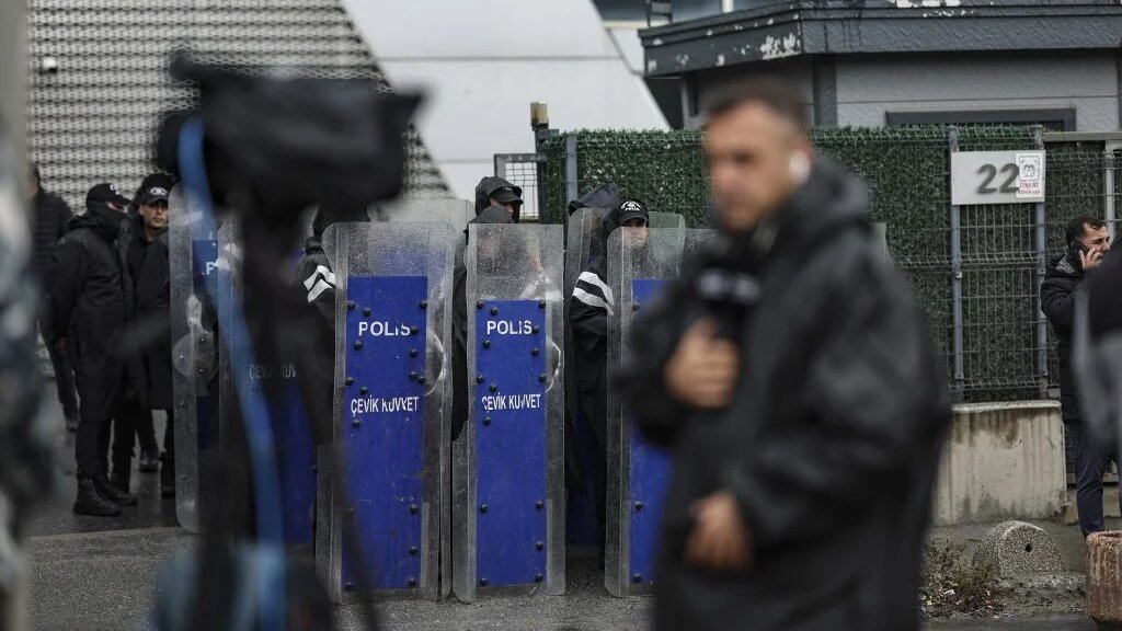 Turkish anti-riot police officers during a raid at the headquarters of pro-opposition Halk TV in Istanbul, on 14 October (AFP/Berk Ozken)