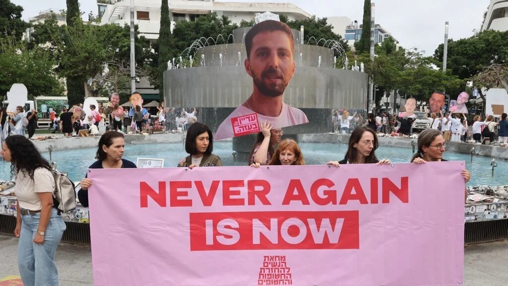 Israelis carry portraits of Israeli hostages, held captive in the Gaza Strip since the October 2023 attacks by Palestinian militants, during a silent gathering in Tel Aviv on 24 April 2025 (Jack Guez/AFP)