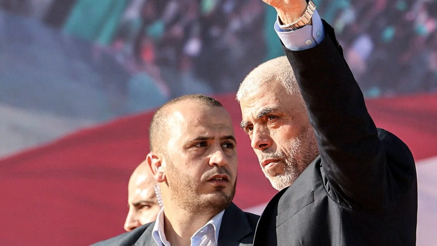 Hamas' Yahia al-Sinwar waves to supporters during a rally marking the 35th anniversary of the group's foundation, in Gaza City on 14 December 2022.