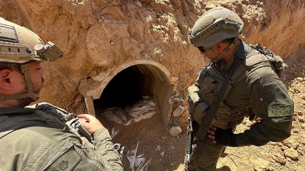 Israeli soldiers checking the entrance of a tunnel in central Gaza (Israeli army/AFP/file photo)