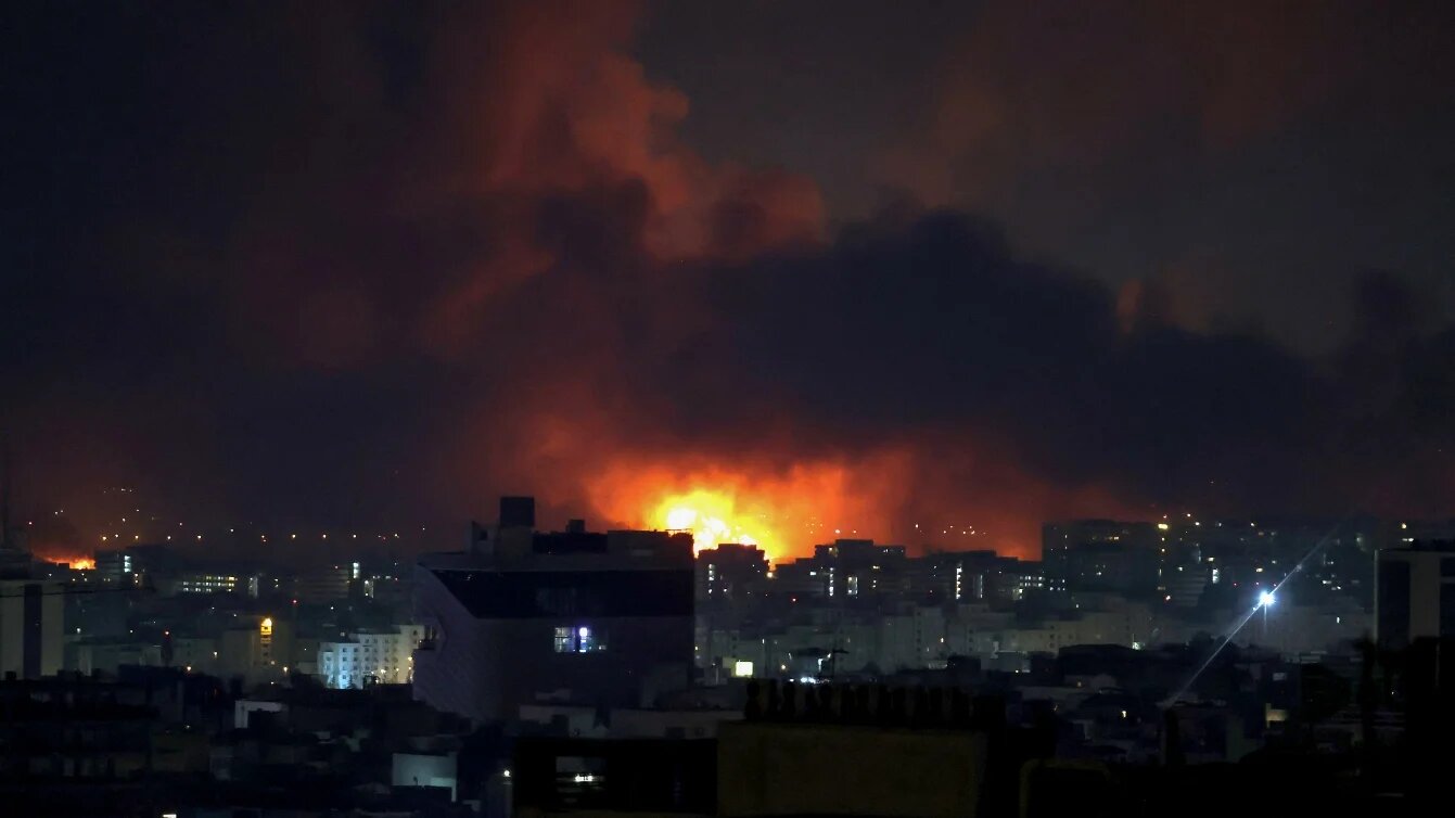 Smoke and fire rise from the site of air strikes at Mehrabad International Airport in Tehran on 7 March 2026 (Atta Kenare/AFP)