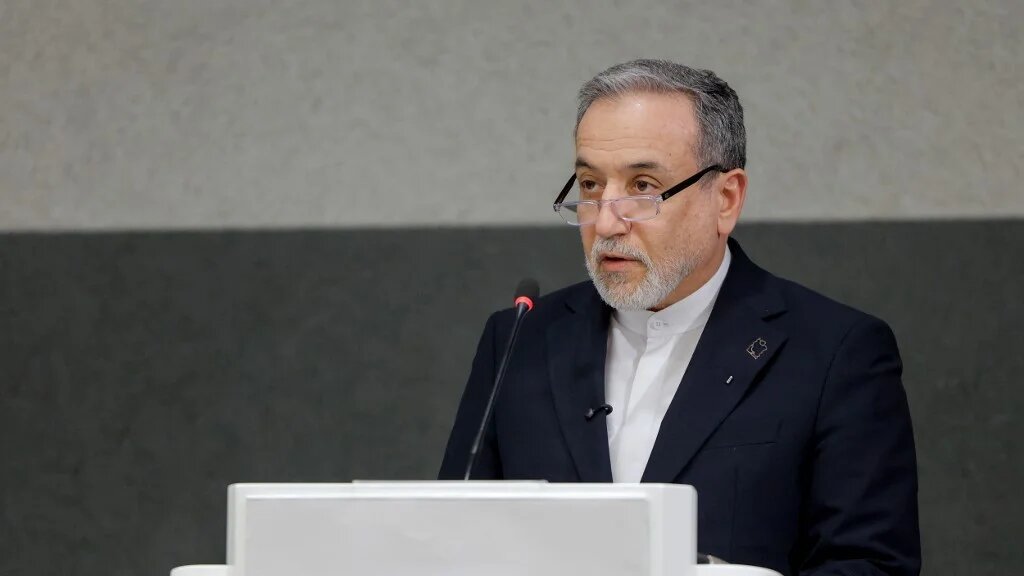 Iran's Foreign Minister Abbas Araghchi delivers a speech in Geneva, 17 on February 2026 (Valentin Flauraud/AFP)