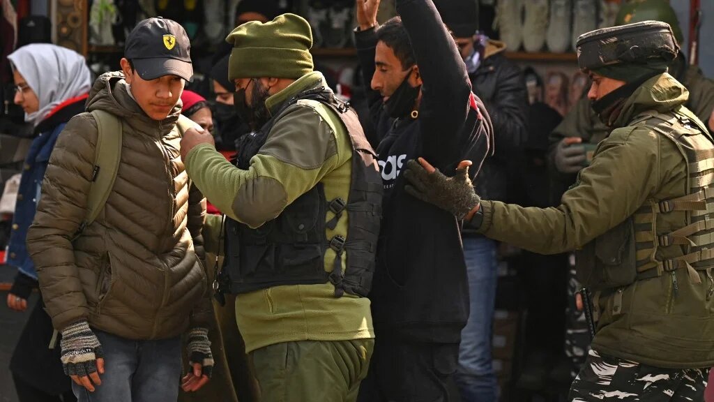 Indian paramilitary troopers search pedestrians ahead of the Republic Day celebrations in Srinagar, Kashmir, 23 January 2023 (AFP)