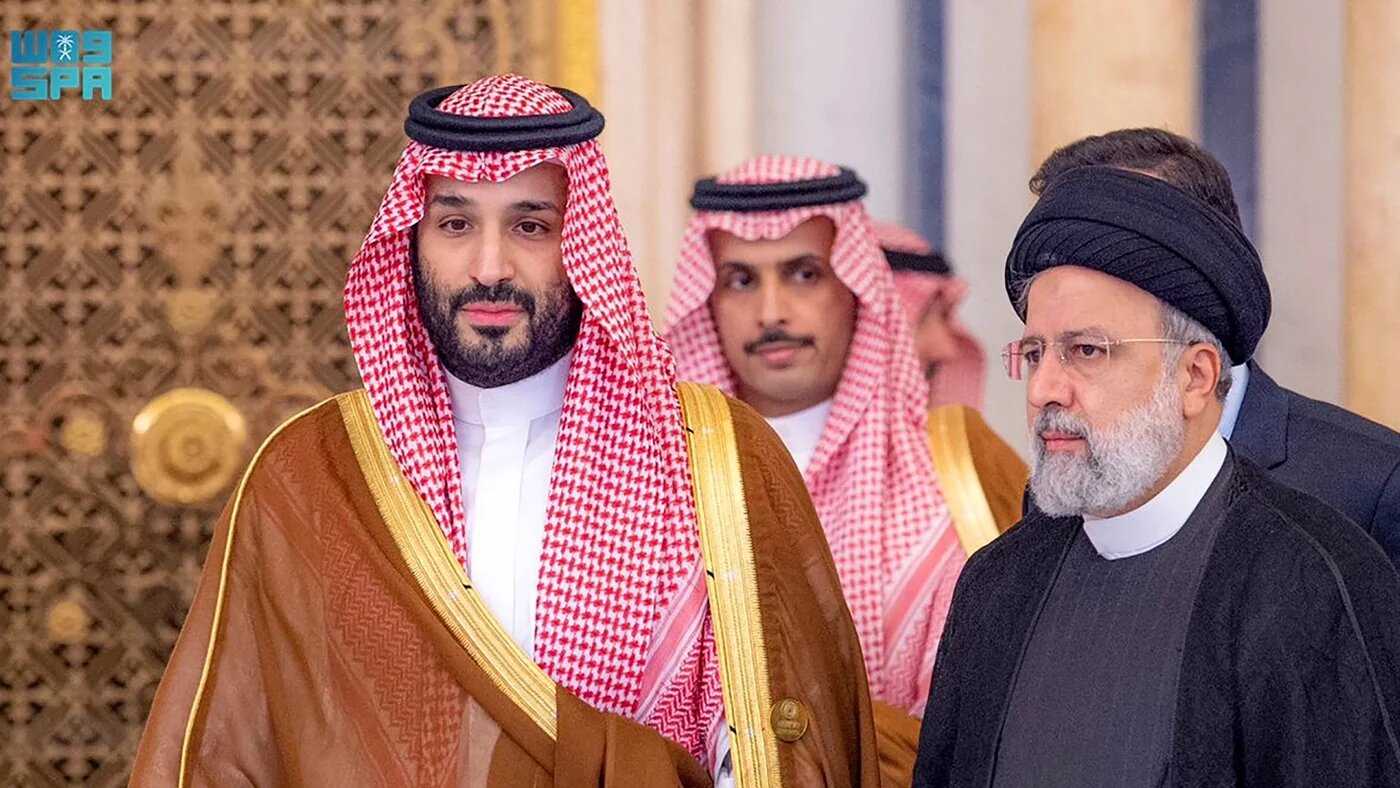 Saudi Crown Prince Mohammed bin Salman and Iran's President Ebrahim Raisi attending an emergency meeting of the Arab League and the Organisation of Islamic Cooperation in Riyadh (AFP/SPA)