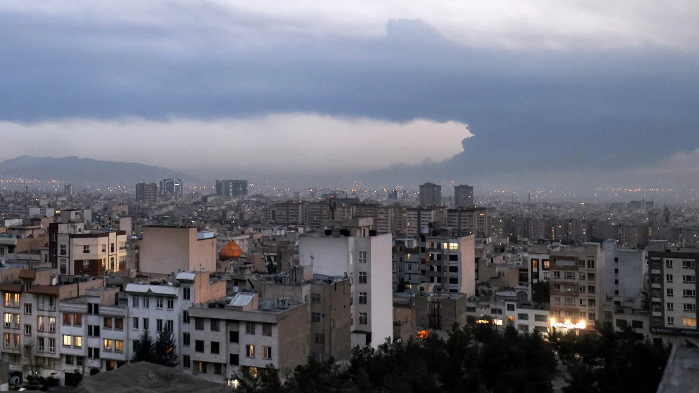 Smoke from the fire at the Tehran Oil Refinery covers the skyline of Tehran on 8 March 2026 (Atta Kenare/AFP)