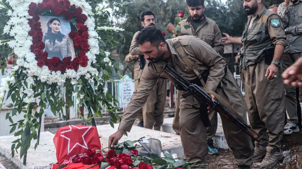 Members of Komala, an Iranian Kurdish opposition party, attend the funeral of Peshmerga fighter Ghazal Moulai at Sheikh Ahmed Hindi cemetery in Sulaymaniyah, Iraqi Kurdistan, on 16 April 2026 (Shwan Mohammed/AFP)