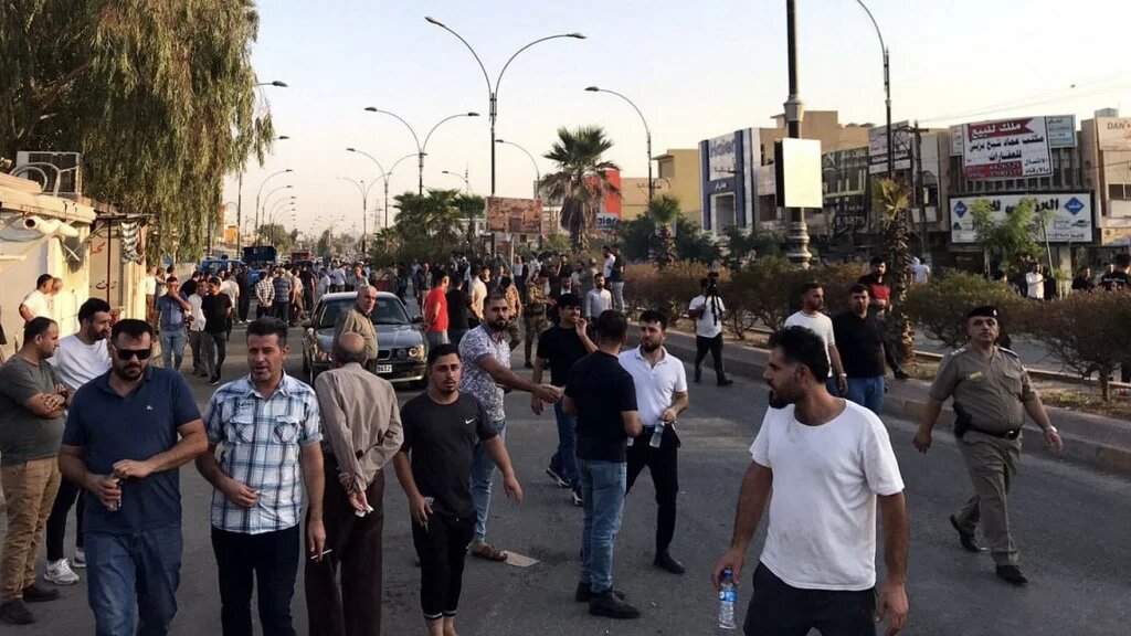 Iraqi protesters block a road following protests in the multi-ethnic Iraqi city of Kirkuk on 2 September 2023 (AFP)